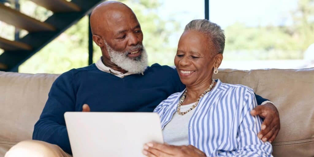Retired couple reviewing retirement risk and savings strategy together