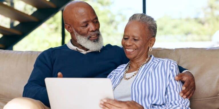 Retired couple reviewing retirement risk and savings strategy together